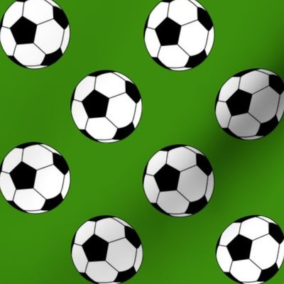 Two Inch Black and White Sports Soccer Balls on Apple Green