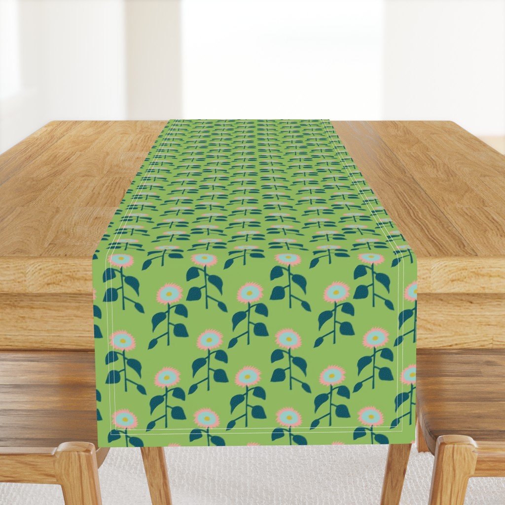 Row of  Sunflowers Pattern on a light green background.