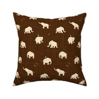 beige elephant on brown