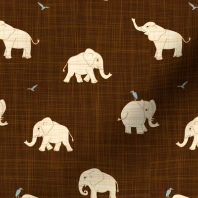 beige elephant on brown