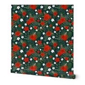 Poinsettia and holly leaves with red berries on dark green