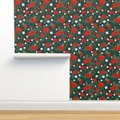 Poinsettia and holly leaves with red berries on dark green
