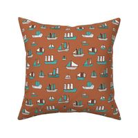 Fishing sailing boats and pirate ships on the shore and at sea copper blue boys winter