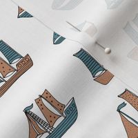 Fishing sailing boats and pirate ships on the shore and at sea blue winter boys