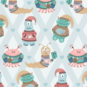 Cozy Monsters in Fair Isle Sweaters on Blue