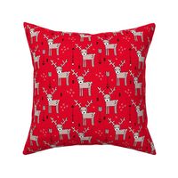 Adorable woodland reindeer and arrows christmas illustration kids pattern design in soft winter red