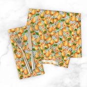 Orange pears in flowers on a light green background