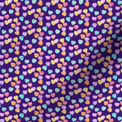 (micro scale) valentines day heart candy - conversation hearts on dark purple C18BS