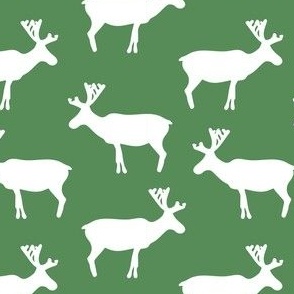 White Reindeer pattern on green background