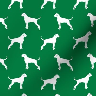 Boxer Dogs on green