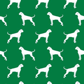 Boxer Dogs on green