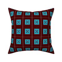 A unique cyan ornamental design with dark red background