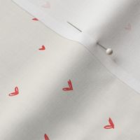 Hot red hearts on bone background