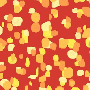 random spots in orange and yellow on red
