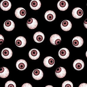 Red devil eyeballs, halloween costume on black