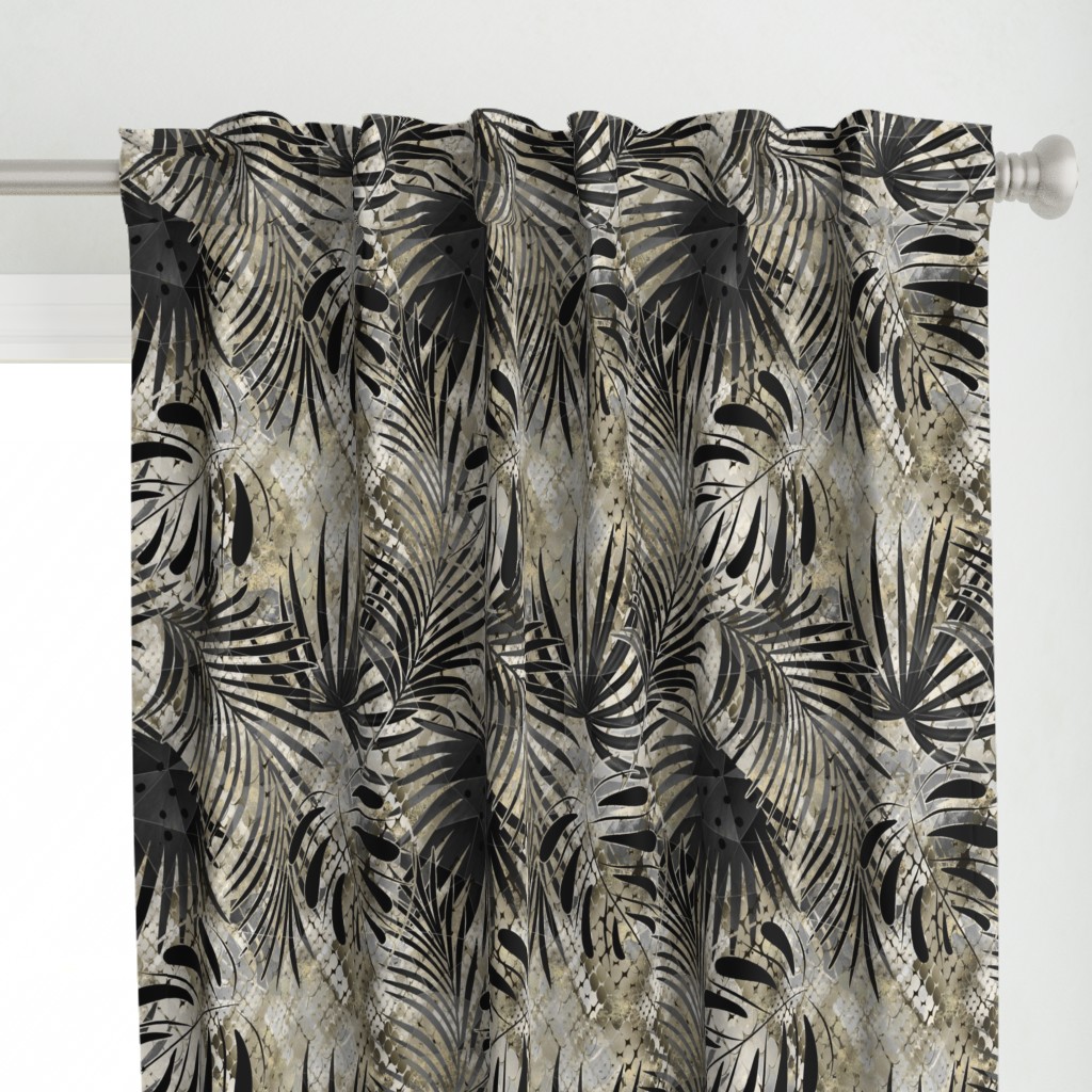 Palm leaves on a background of snake skin.