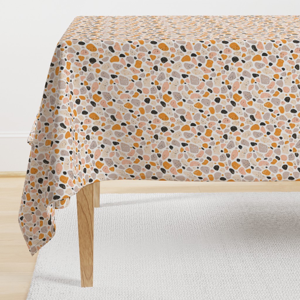 Terrazzo grey, orange and pink pebbles seamless pattern