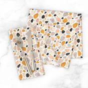 Terrazzo grey, orange and pink pebbles seamless pattern