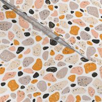 Terrazzo grey, orange and pink pebbles seamless pattern