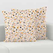 Terrazzo grey, orange and pink pebbles seamless pattern