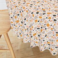 Terrazzo grey, orange and pink pebbles seamless pattern