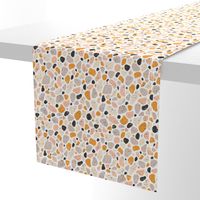 Terrazzo grey, orange and pink pebbles seamless pattern