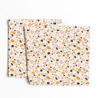 Terrazzo grey, orange and pink pebbles seamless pattern