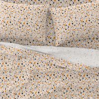 Terrazzo grey, orange and pink pebbles seamless pattern