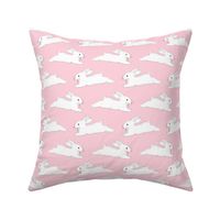 Leaping White Bunnies on Pink