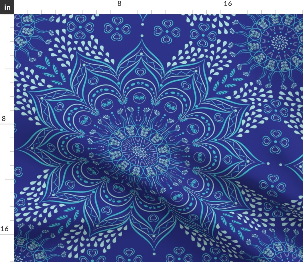 Teal mandala on dark blue background 