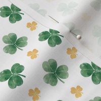 Three-leaf clovers in green and gold