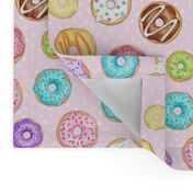 Scattered Rainbow Donuts on pale pink spotty - medium scale