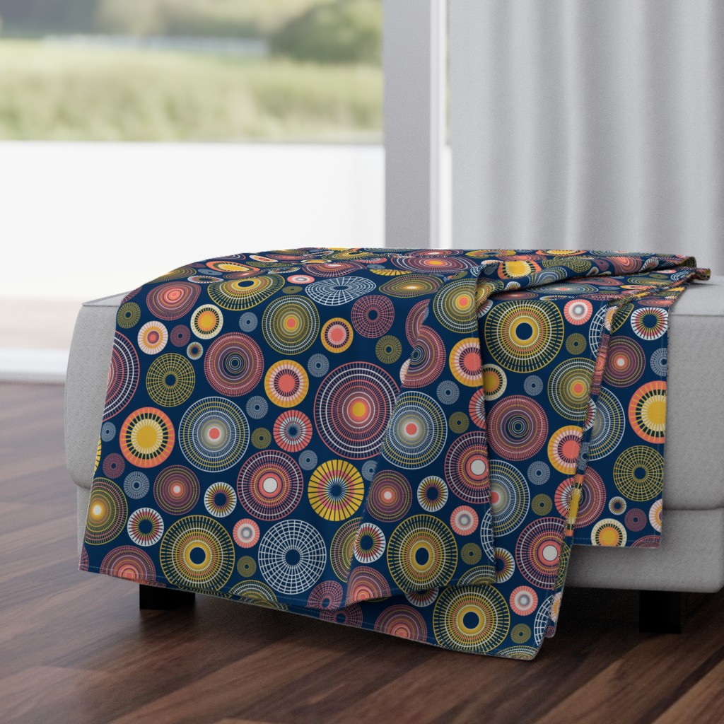 colorful concentric circles on dark blue | medium