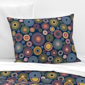 colorful concentric circles on dark blue | medium