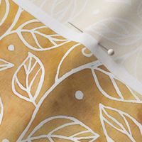 Abstract branches and leaves on gold, yellow watercolor texture
