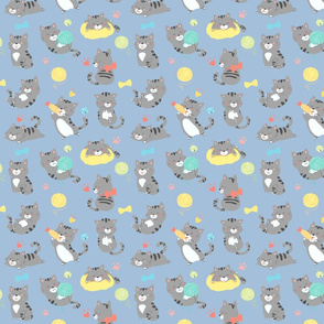 Playful gray kittens on blue