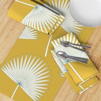 Boho sunshine palm leaves on mustard green