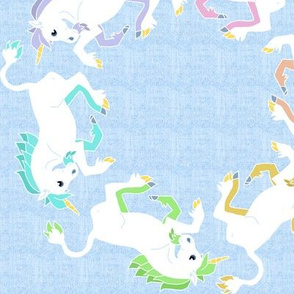 Rainbow Unicorns Circling on Blue Linen Look Background