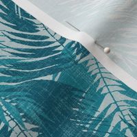 big tropical palm leaves in icy blues