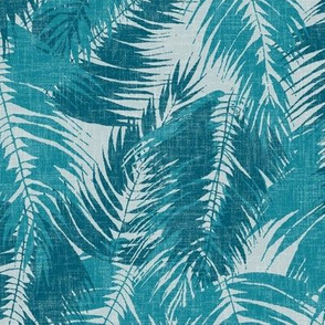 big tropical palm leaves in icy blues