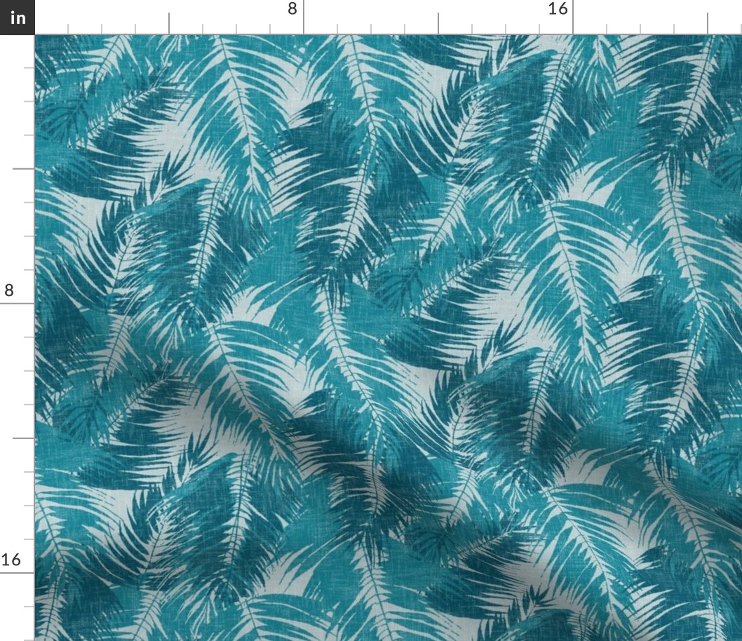 big tropical palm leaves in icy blues