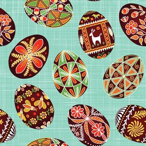 Pysanky on turquoise linen