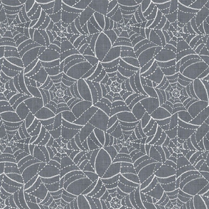 Cobwebs on textured grey