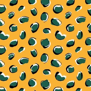 Emerald leopard spots on sunny yellow