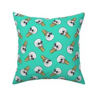 skull ice cream cones - toss on teal - LAD19