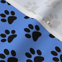 One Inch Black Paw Prints on Cornflower Blue