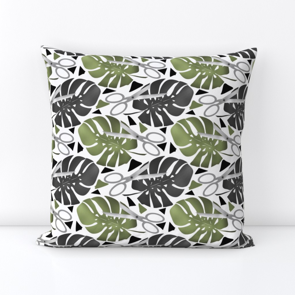 Tropical print monstera leaves and scissors