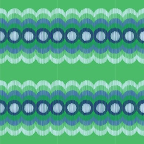 scallop circle blurred green and blue back green