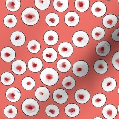 black circles on coral background