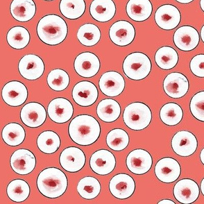 black circles on coral background